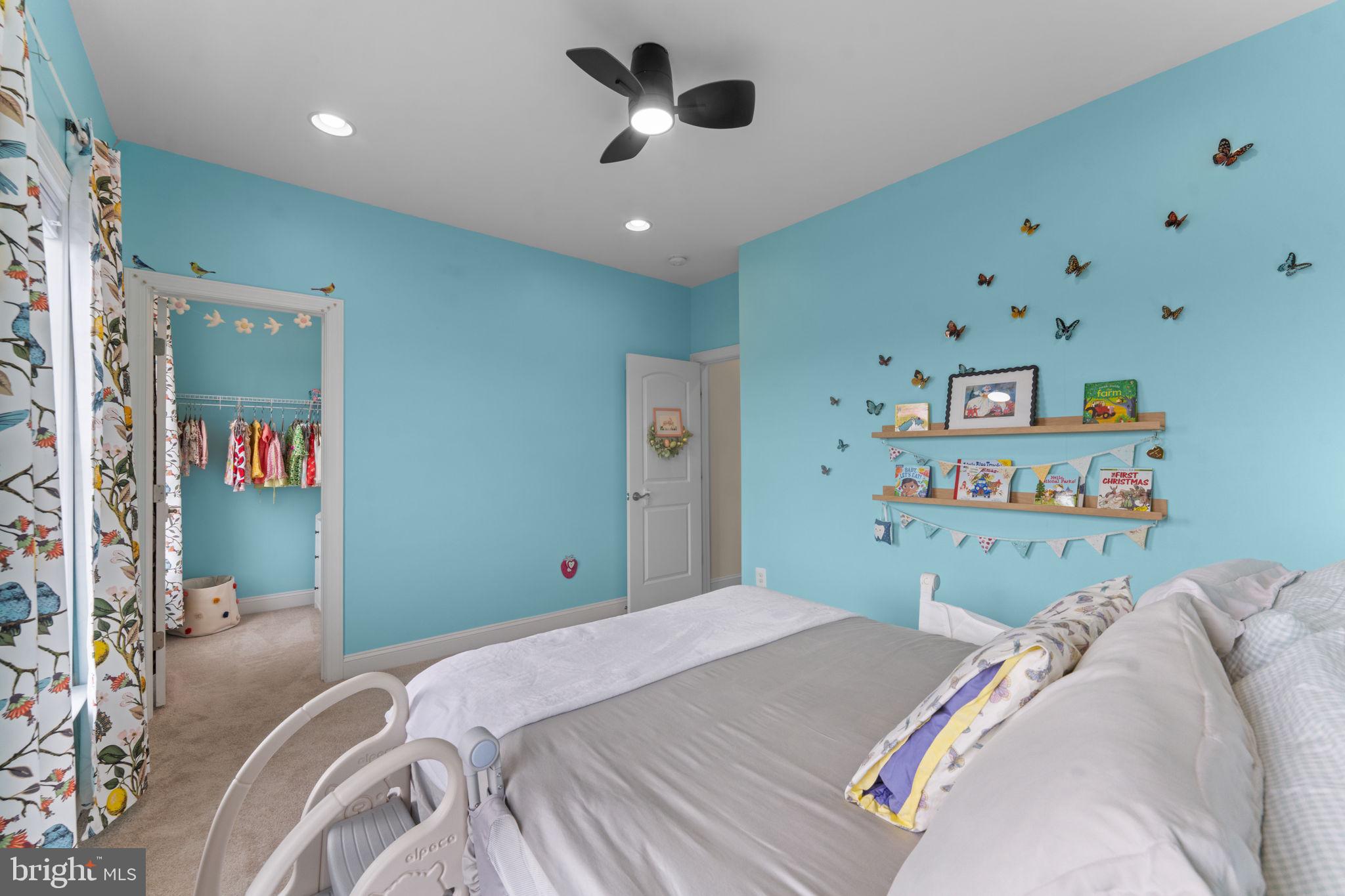 16756 Misty Ridge Lane Purcellville, VA 20132 - Photo 61 of 92 a bedroom with a bed and a book shelf