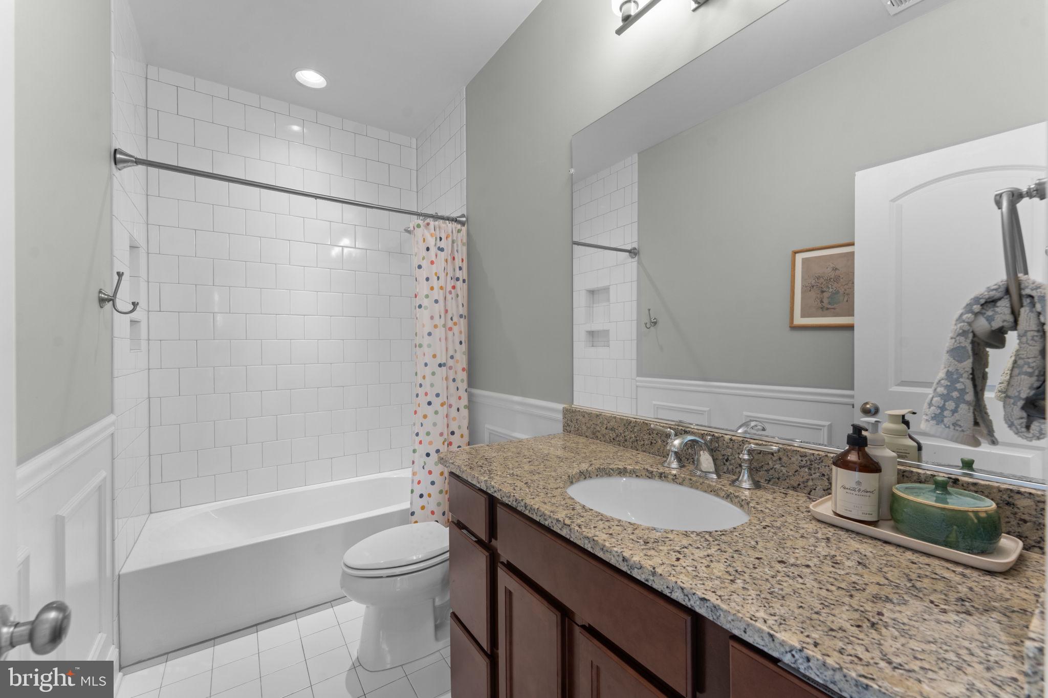 16756 Misty Ridge Lane Purcellville, VA 20132 - Photo 63 of 92 a bathroom with a granite countertop sink toilet and shower