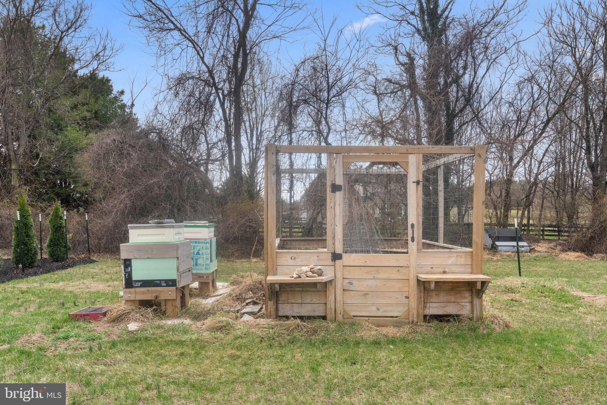 16756 Misty Ridge Lane Purcellville, VA 20132 - Photo 79 of 92 a view of a house with backyard and a bench