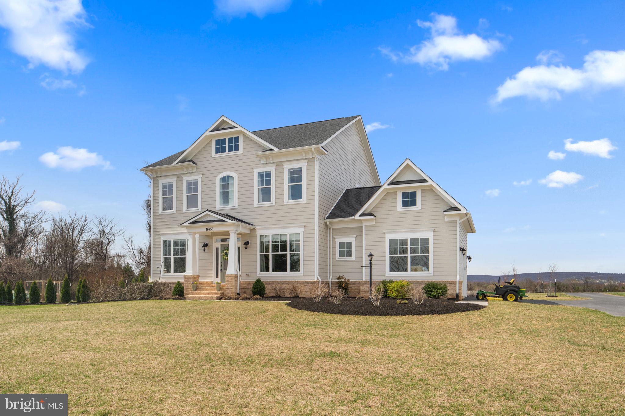 16756 Misty Ridge Lane Purcellville, VA 20132 - Photo 83 of 92 a front view of a house with yard and lake view