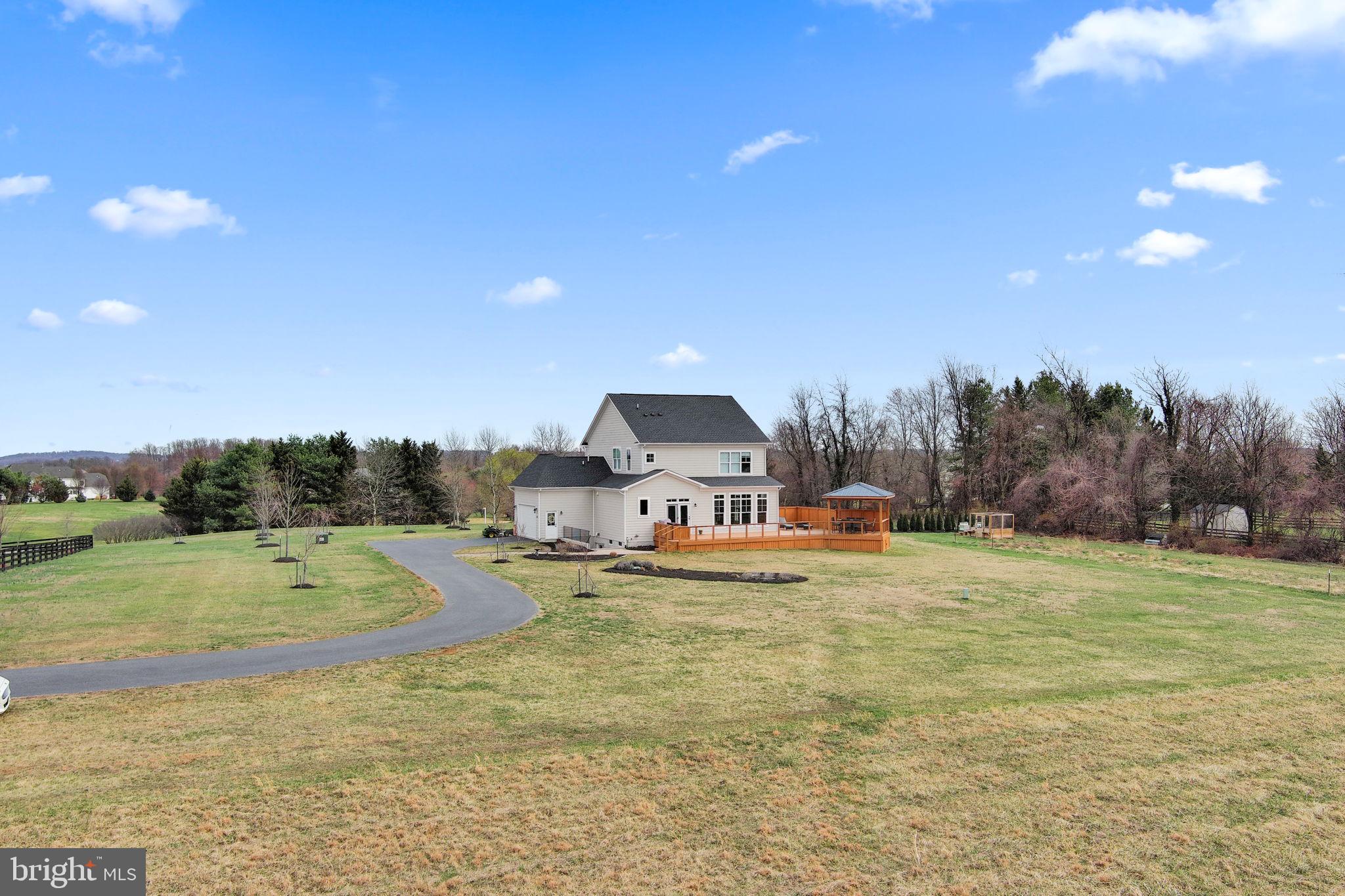 16756 Misty Ridge Lane Purcellville, VA 20132 - Photo 90 of 92 a view of a yard with an house