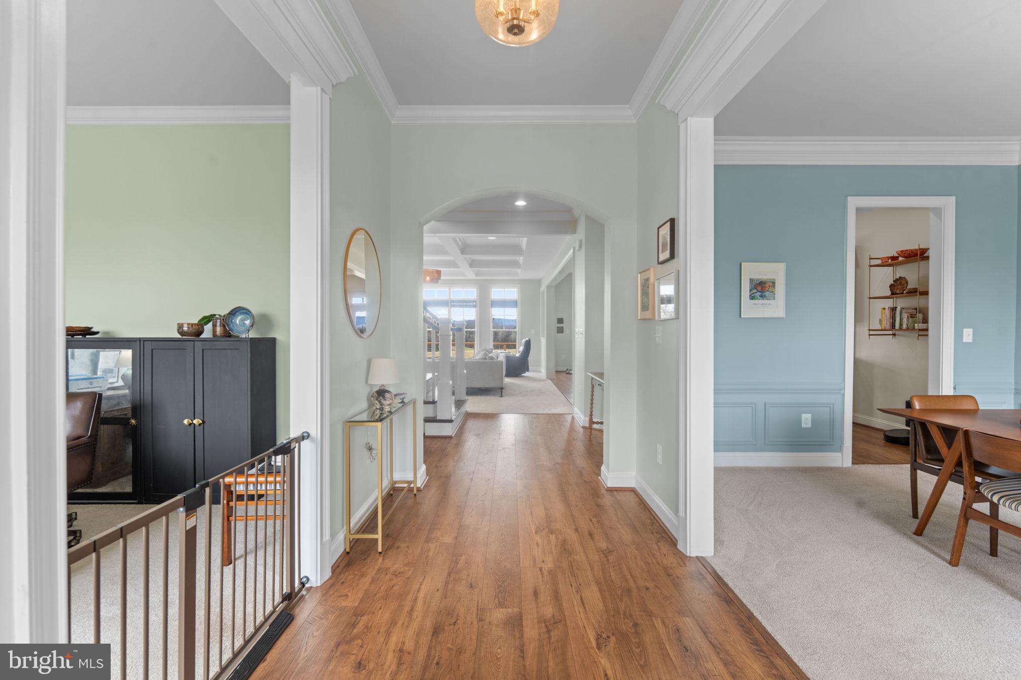 16756 Misty Ridge Lane Purcellville, VA 20132 - Photo 9 of 92 a view of a hallway view with wooden floor and furniture