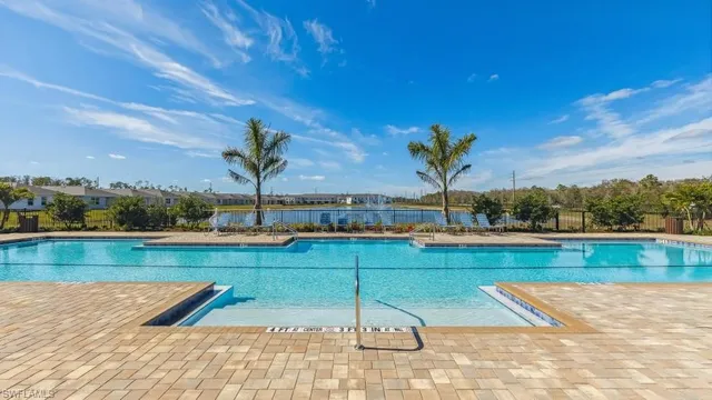 a view of a swimming pool and an outdoor seating