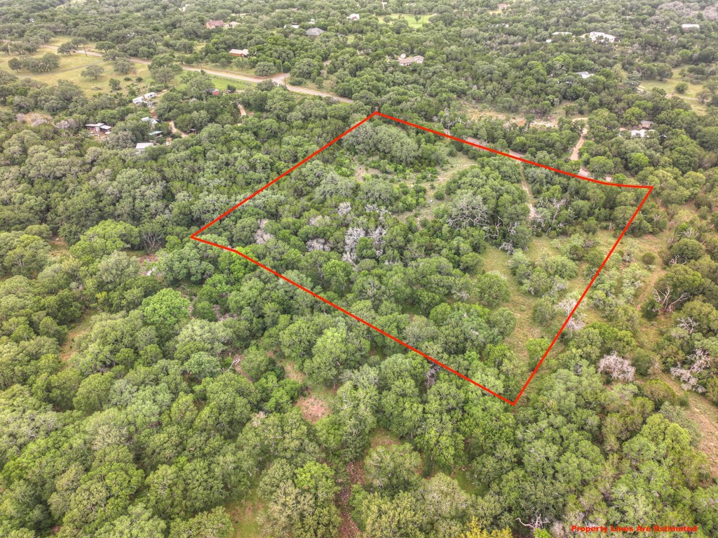 211 Hunters Glen Road San Marcos, TX 78666 - Photo 2 of 27 a view of a city from a lush green forest