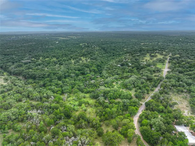a view of a field with an ocean