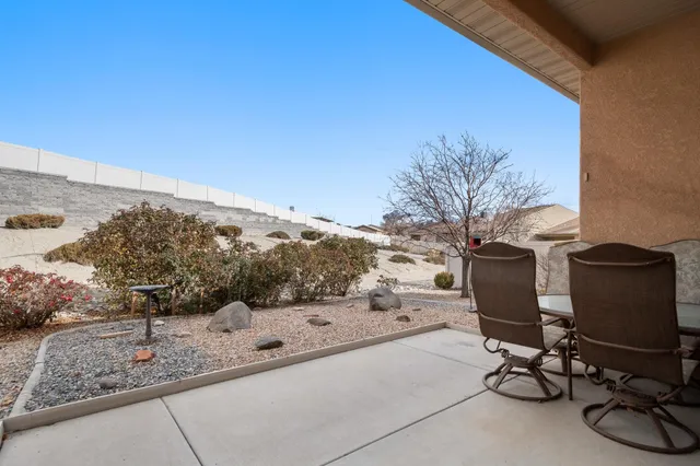 a view of a terrace with chair and barbeque grill