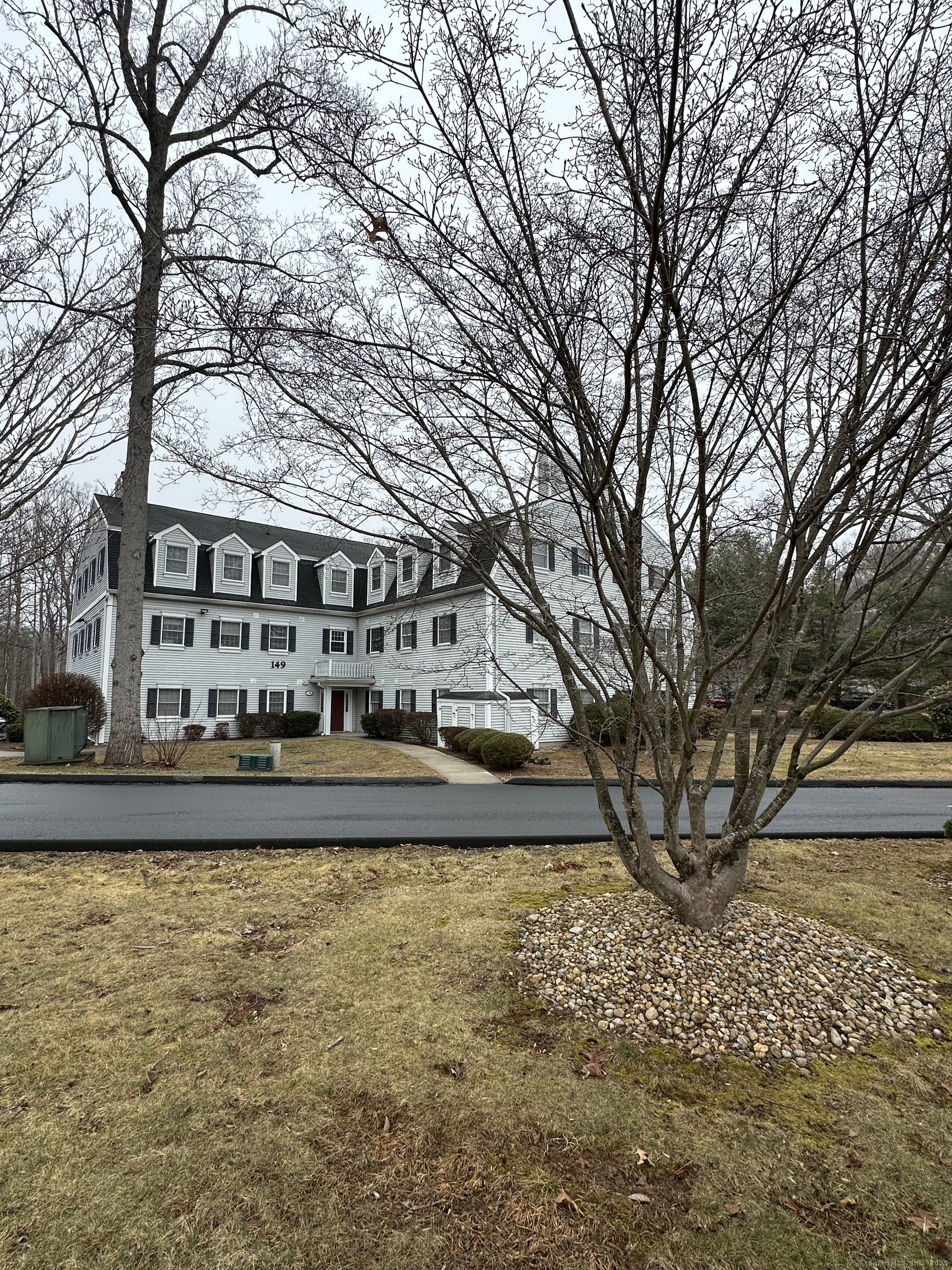 a front view of a house with swimming pool and porch