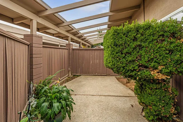 a backyard of a house with plants