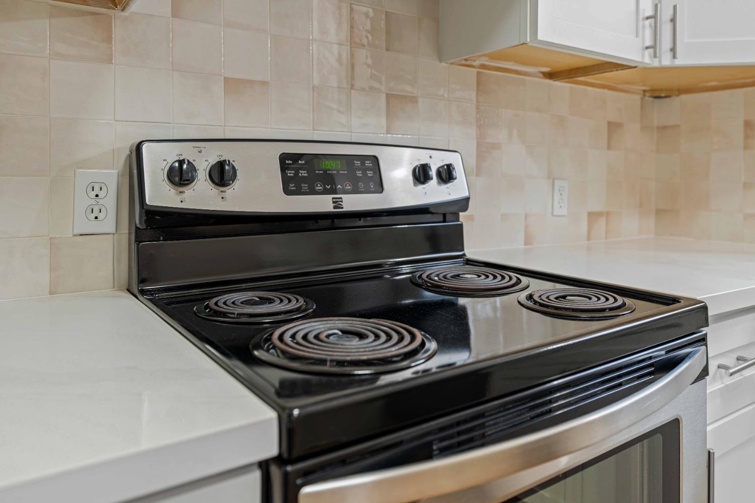 805 Tully Road, Unit 5 Modesto, CA 95350 - Photo 7 of 25 a stove top oven sitting inside of a kitchen
