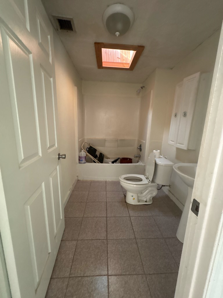 2910 Beech Street Columbus, GA 31909 - Photo 16 of 24 a bathroom with a toilet