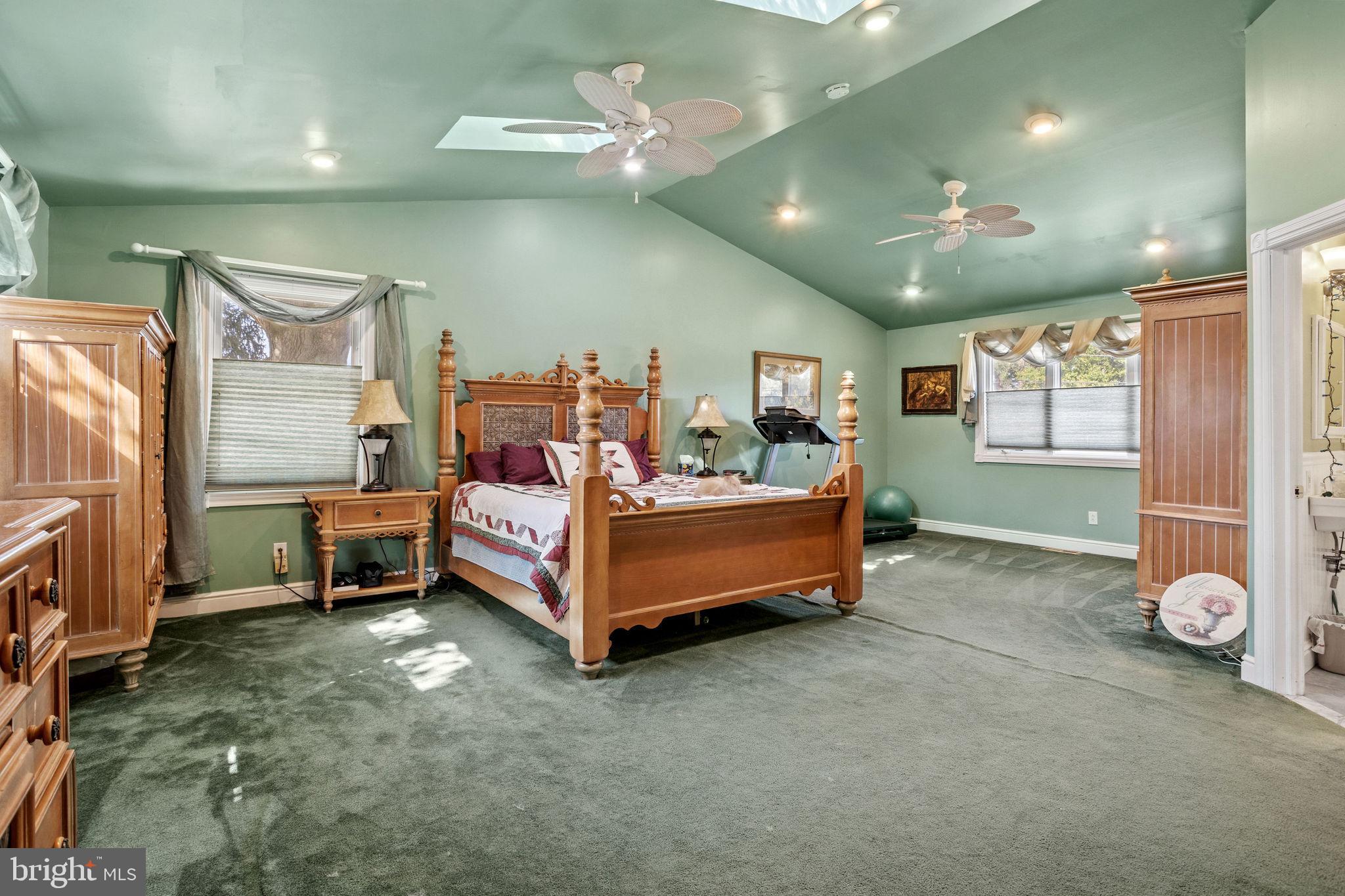 810 Colby Avenue Delran, NJ 08075 - Photo 17 of 33 a bedroom with a bed and a chandelier