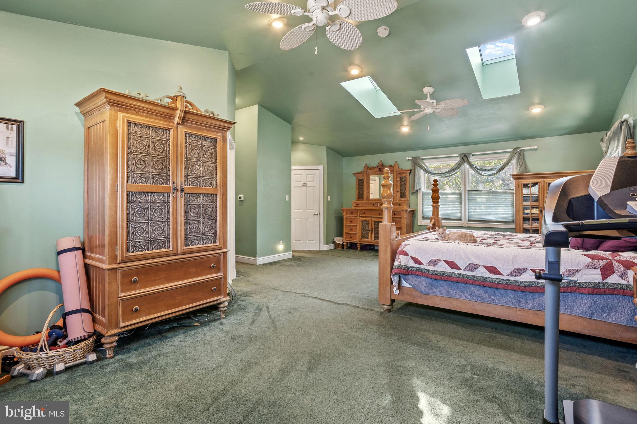 810 Colby Avenue Delran, NJ 08075 - Photo 18 of 33 a spacious bedroom with a bed and a chandelier