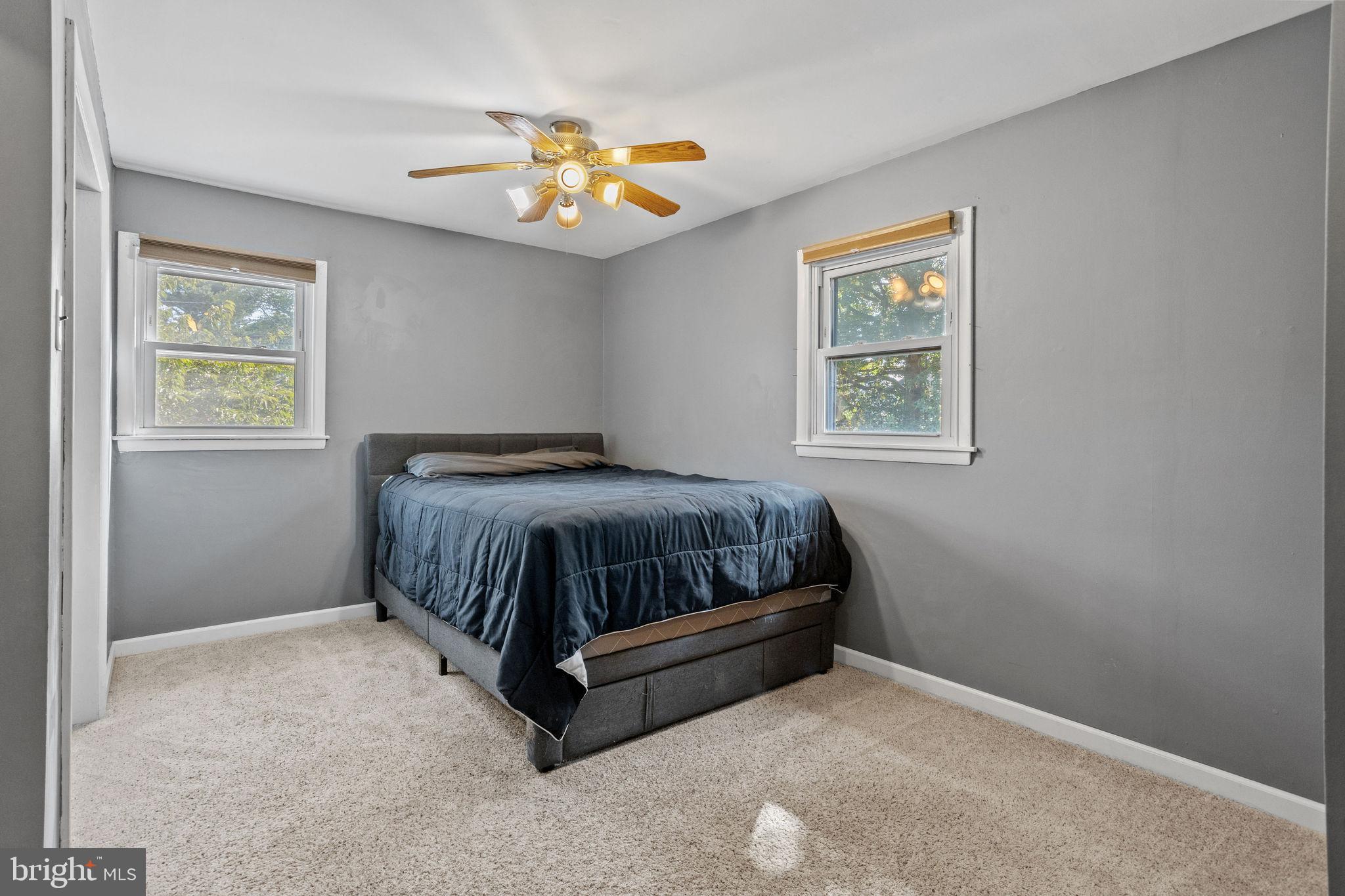 810 Colby Avenue Delran, NJ 08075 - Photo 23 of 33 a bedroom with a bed and a chandelier