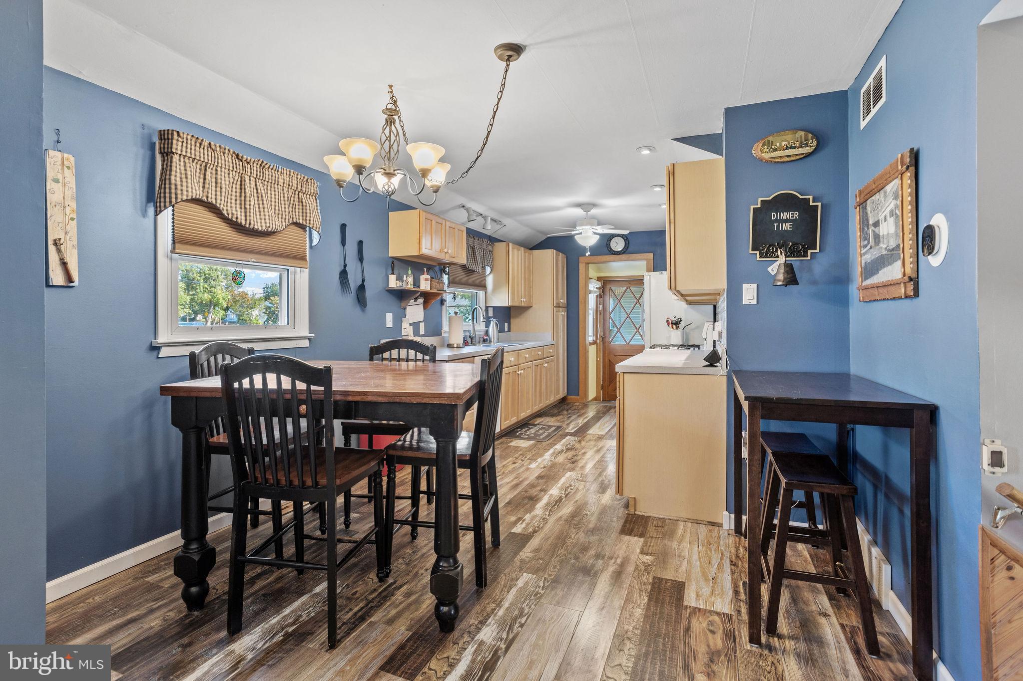 810 Colby Avenue Delran, NJ 08075 - Photo 8 of 33 a view of a dining room with furniture a chandelier and wooden floor