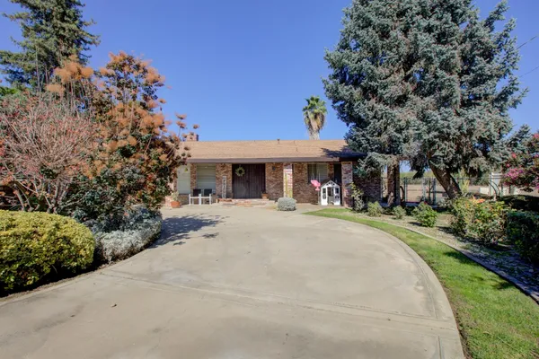 front view of a house with a garden