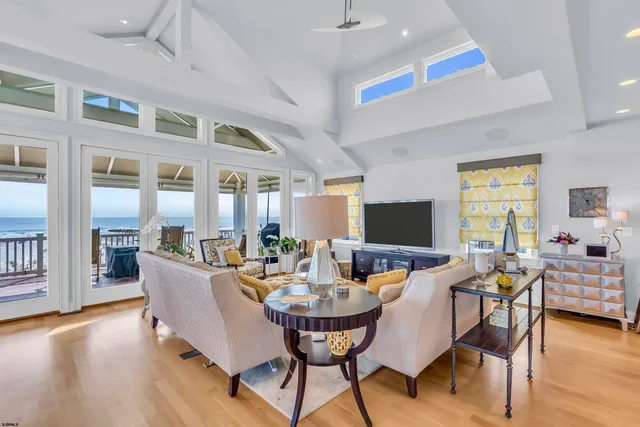 a view of a dining room with furniture wooden floor and chandelier