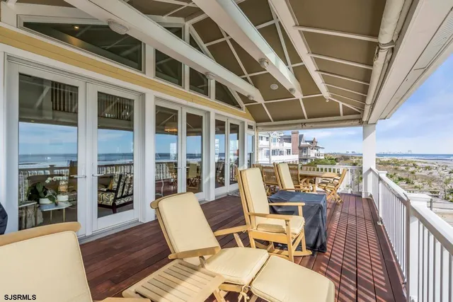 a view of a hallway view with wooden floor and staircase