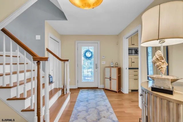 a view of an entryway with wooden floor