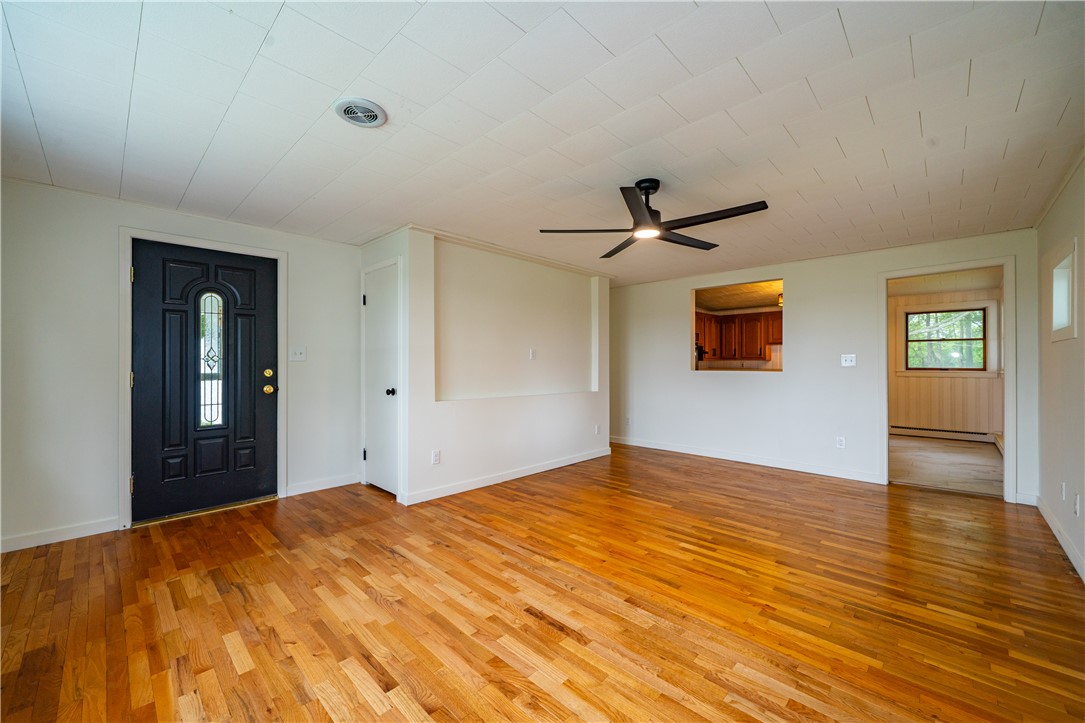 11296 Pansing Road Brookville, OH 45309 - Photo 6 of 53 This living area features a bright entrance and gleaming hardwood floors, creating an inviting atmosphere.