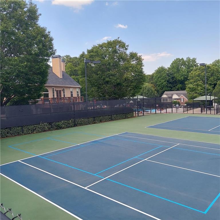 3195 Stonecrest Drive Cumming, GA 30041 - Photo 11 of 63 a view of a tennis court