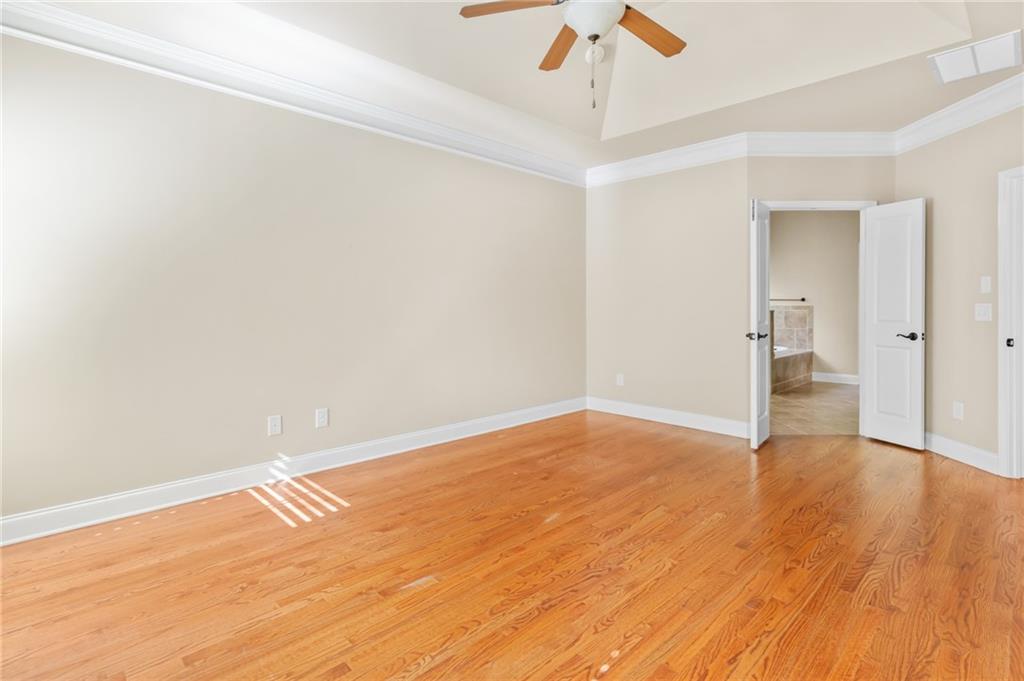 3195 Stonecrest Drive Cumming, GA 30041 - Photo 37 of 63 wooden floor in an empty room