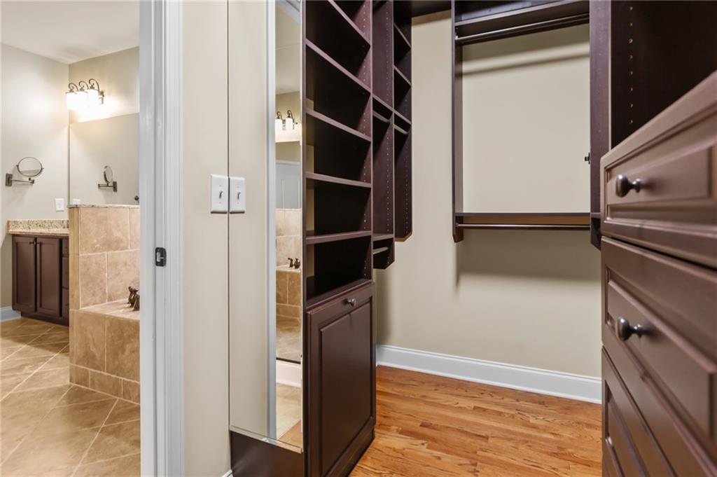 3195 Stonecrest Drive Cumming, GA 30041 - Photo 42 of 63 a view of walk in closet with empty racks