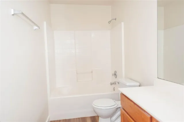 a bathroom with a sink a toilet and a bathtub