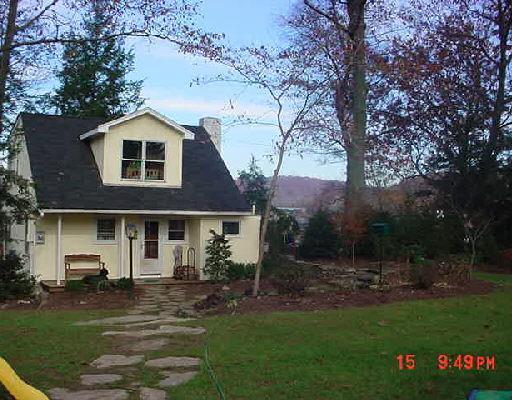 224 Riverside Road Newtown, CT 06482 - Photo 1 of 1 a front view of a house with a garden