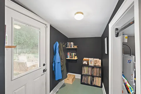 a view of an entryway and livingroom with furniture