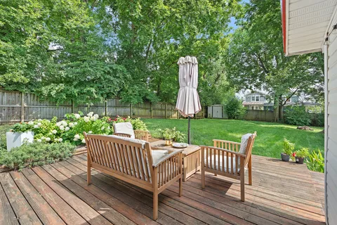 a view of a wooden deck with a bench