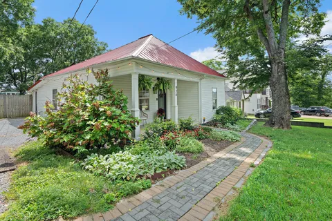 a front view of a house with garden