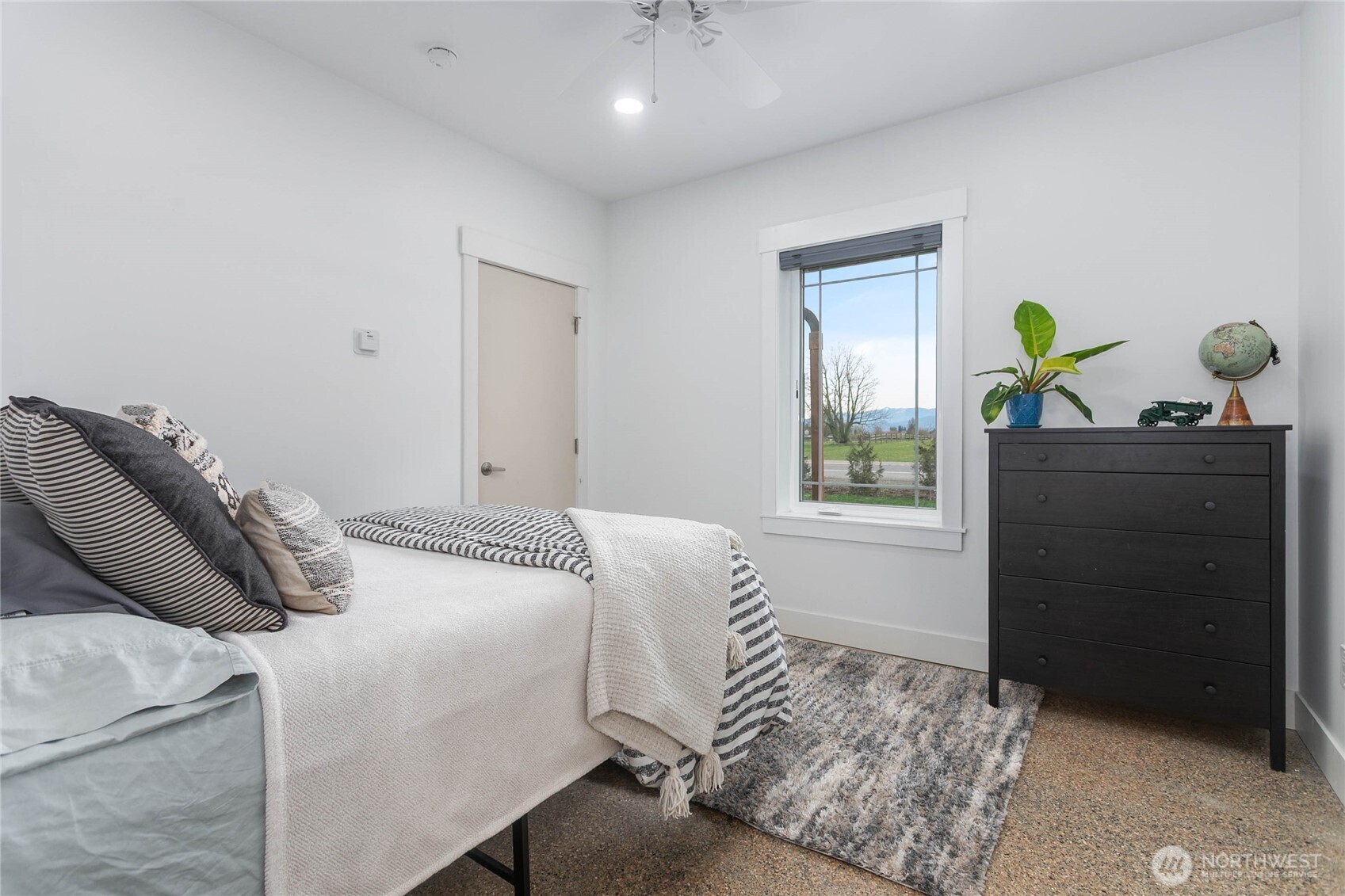 7393 Hannegan Road Lynden, WA 98264 - Photo 16 of 29 a bedroom with a bed and window