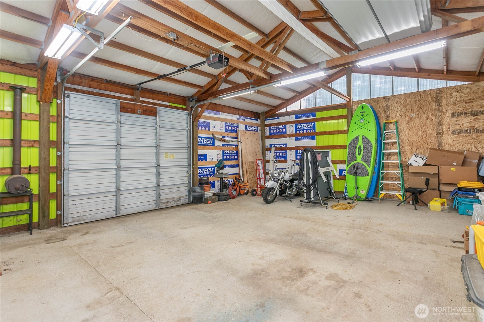 7393 Hannegan Road Lynden, WA 98264 - Photo 23 of 29 a view of a garage with parked cars