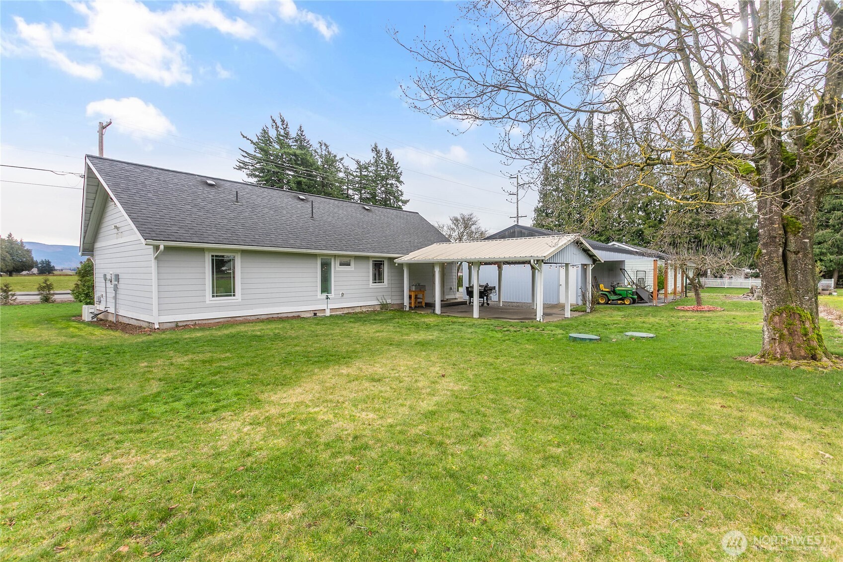 7393 Hannegan Road Lynden, WA 98264 - Photo 25 of 29 a front view of a house with yard and green space