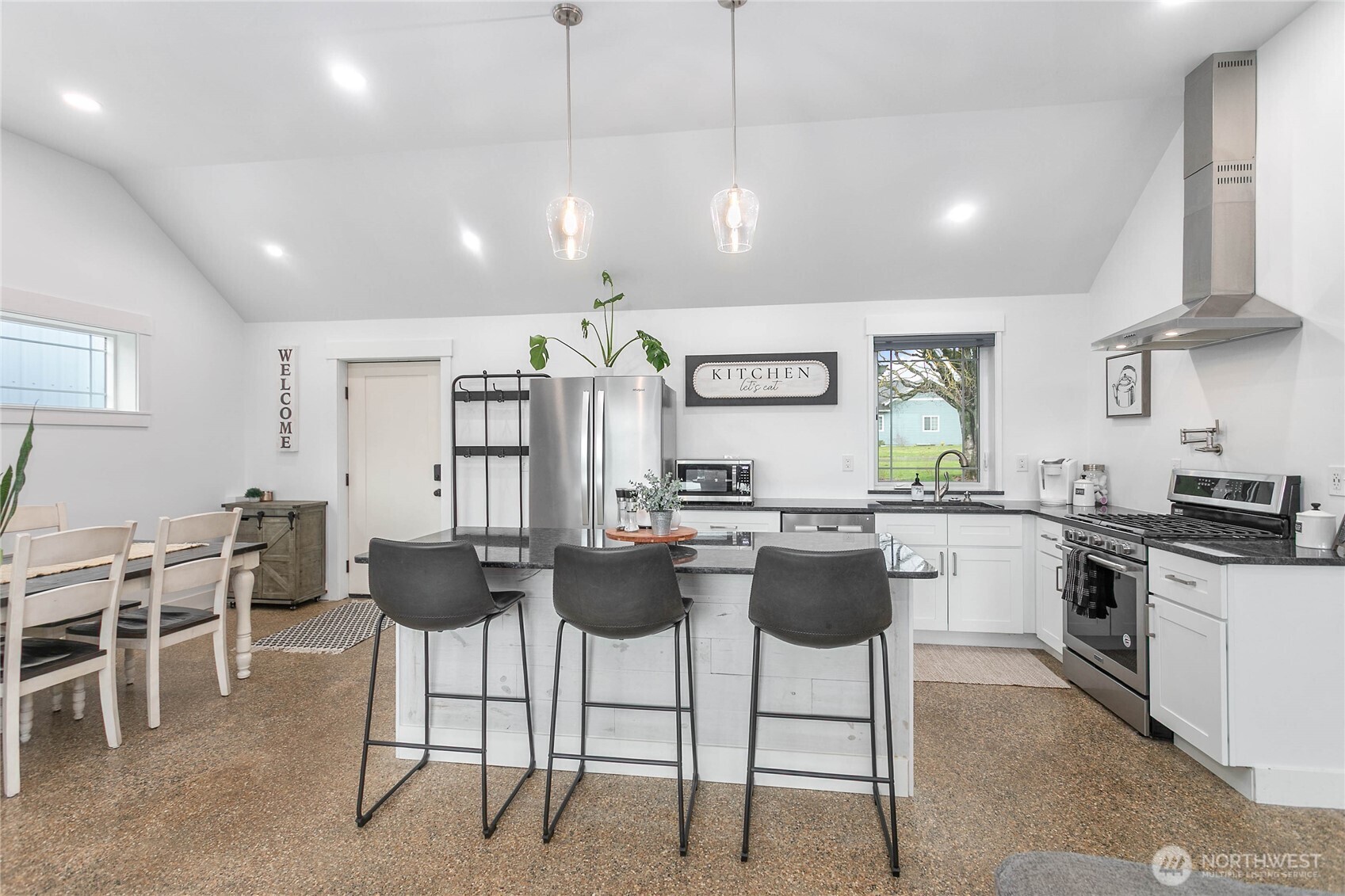 7393 Hannegan Road Lynden, WA 98264 - Photo 9 of 29 a kitchen with lots of counter space and stainless steel appliances