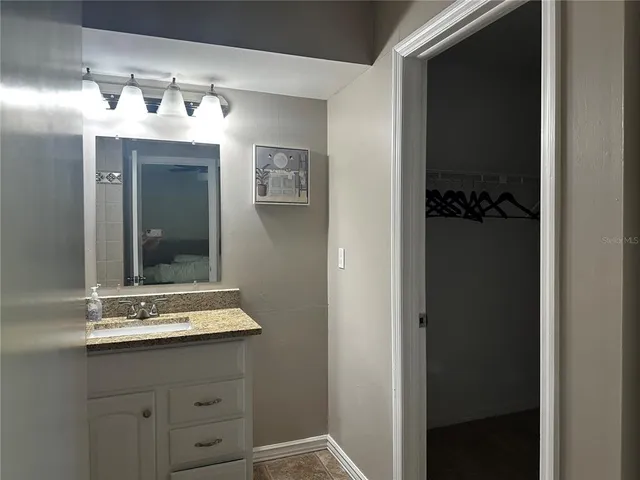 a view of a two chair and table in the patio