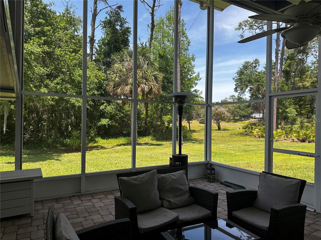 5434 Saddlebrook Way, Unit 3 Wesley Chapel, FL 33543 - Photo 16 of 17 a view of a two chair and table in the patio