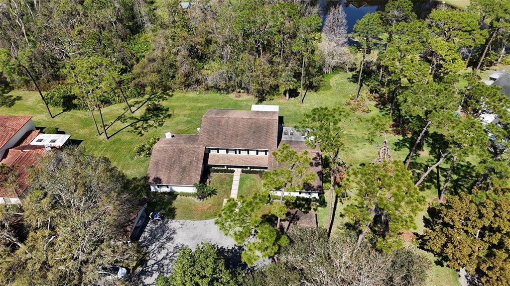 5434 Saddlebrook Way, Unit 3 Wesley Chapel, FL 33543 - Photo 17 of 17 an aerial view of a house with a yard