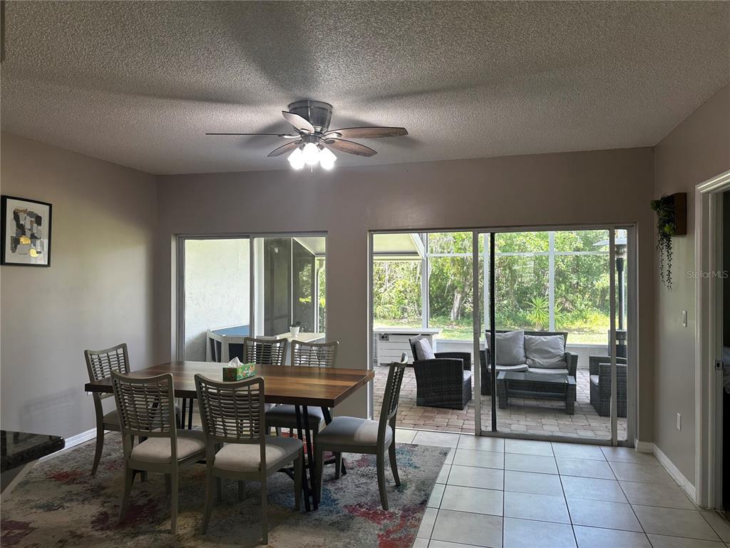 5434 Saddlebrook Way, Unit 3 Wesley Chapel, FL 33543 - Photo 9 of 17 a view of a dining room with furniture window and outside view