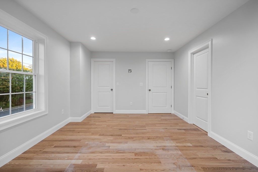 108 High Street, Unit B Wareham, MA 02571 - Photo 27 of 31 a view of empty room with window and wooden floor