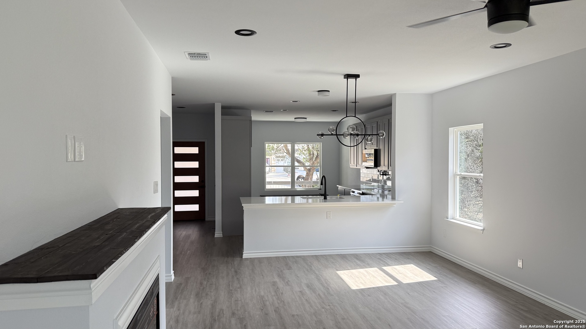 124 Lookout Court Spring Branch, TX 78070 - Photo 11 of 28 wooden floor in an empty room with a window