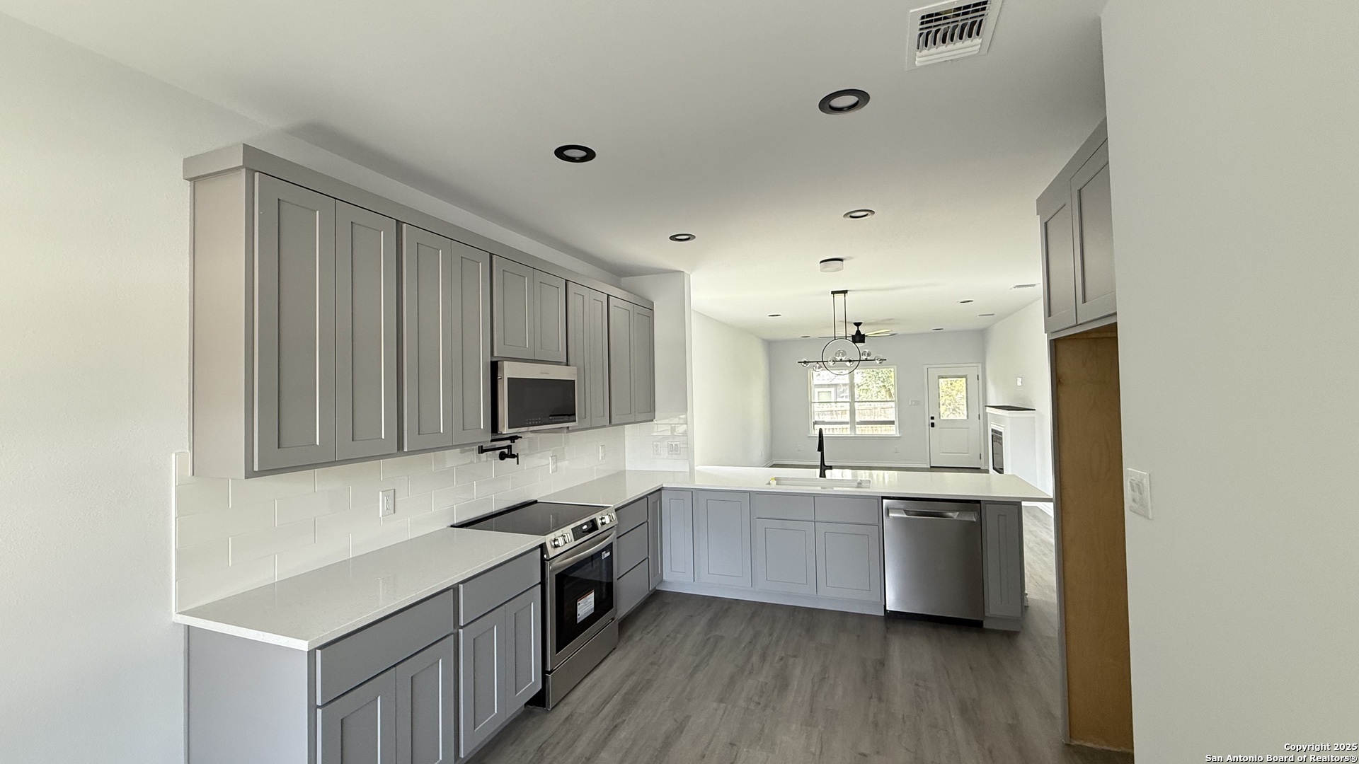 124 Lookout Court Spring Branch, TX 78070 - Photo 16 of 28 a kitchen with a sink cabinets and wooden floor