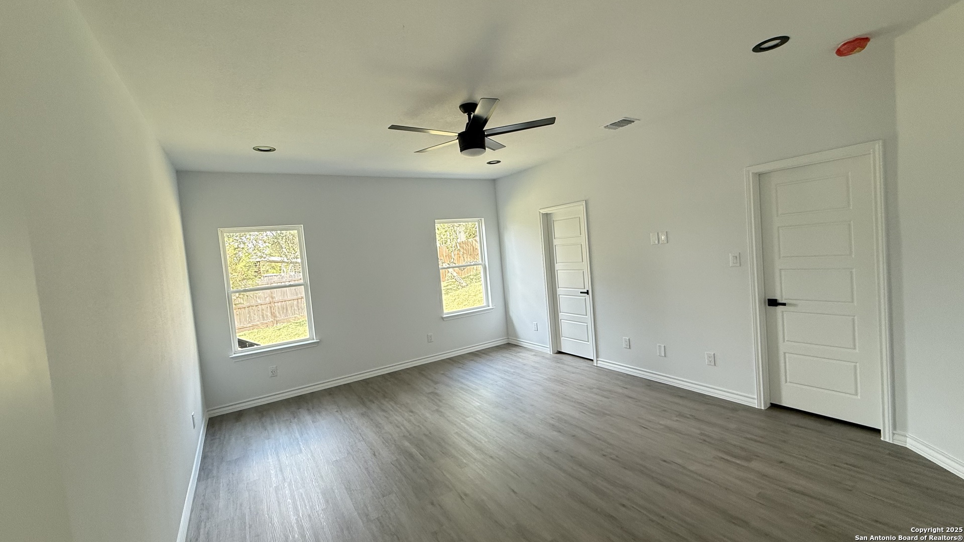 124 Lookout Court Spring Branch, TX 78070 - Photo 21 of 28 wooden floor in an empty room with a window