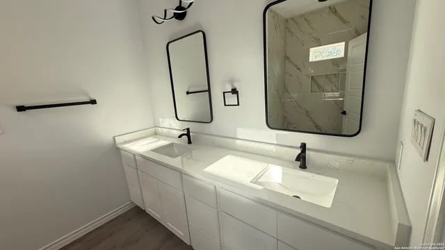 a bathroom with a sink and mirror