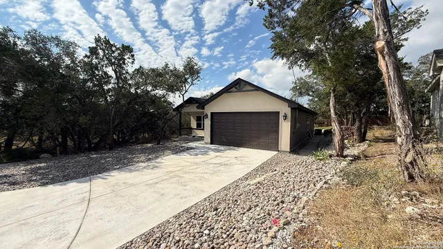 a wooden bench sitting in front of a house