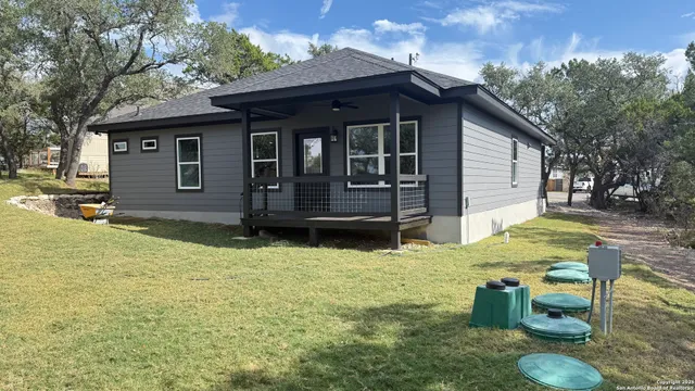a view of house with backyard