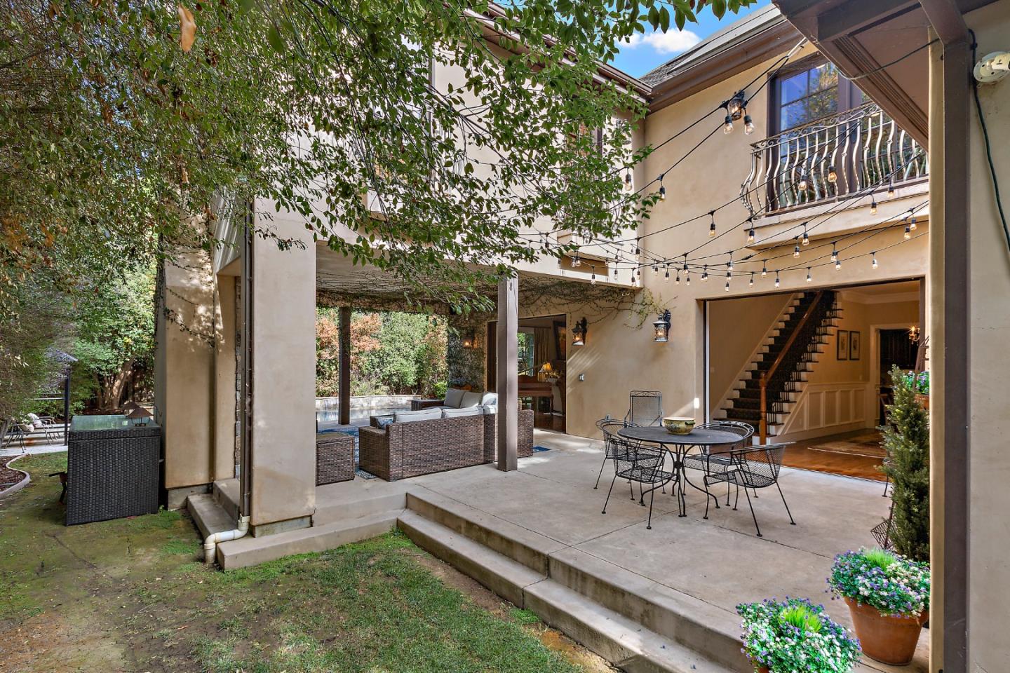 1187 Clark Way San Jose, CA 95125 - Photo 19 of 81 a view of a patio with table and chairs potted plants and a large tree