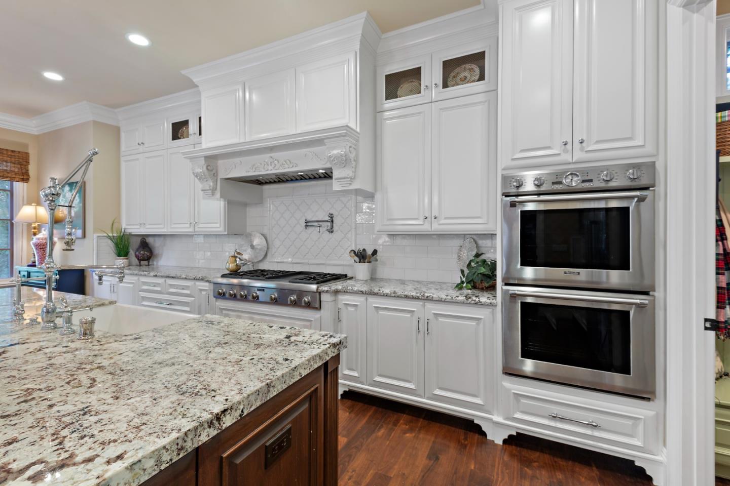 1187 Clark Way San Jose, CA 95125 - Photo 37 of 81 a kitchen with stainless steel appliances granite countertop a stove microwave and cabinets