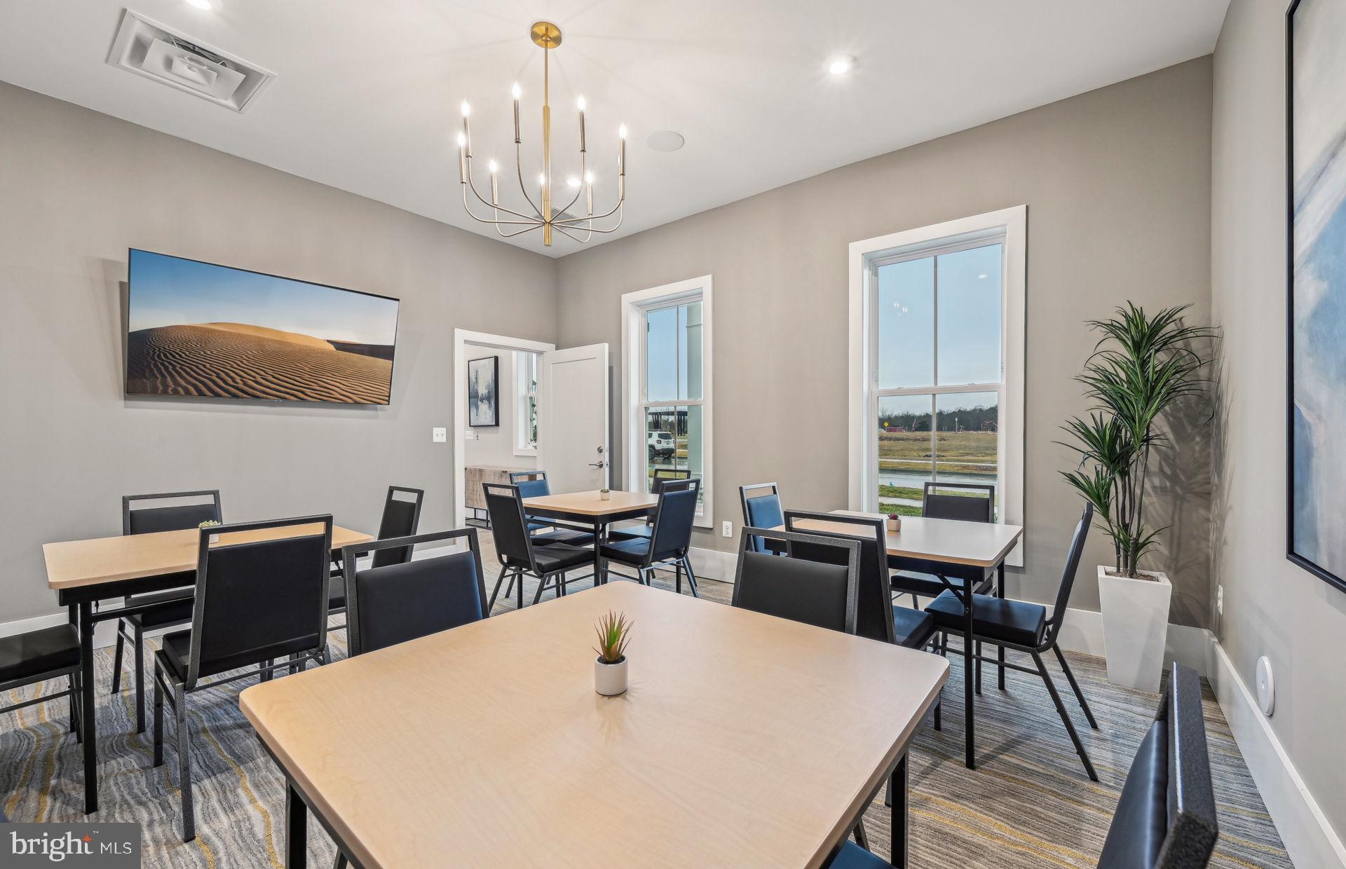 22424 Sculpin Brk Road Boyds, MD 20841 - Photo 33 of 37 a view of a dining room with furniture and wooden floor