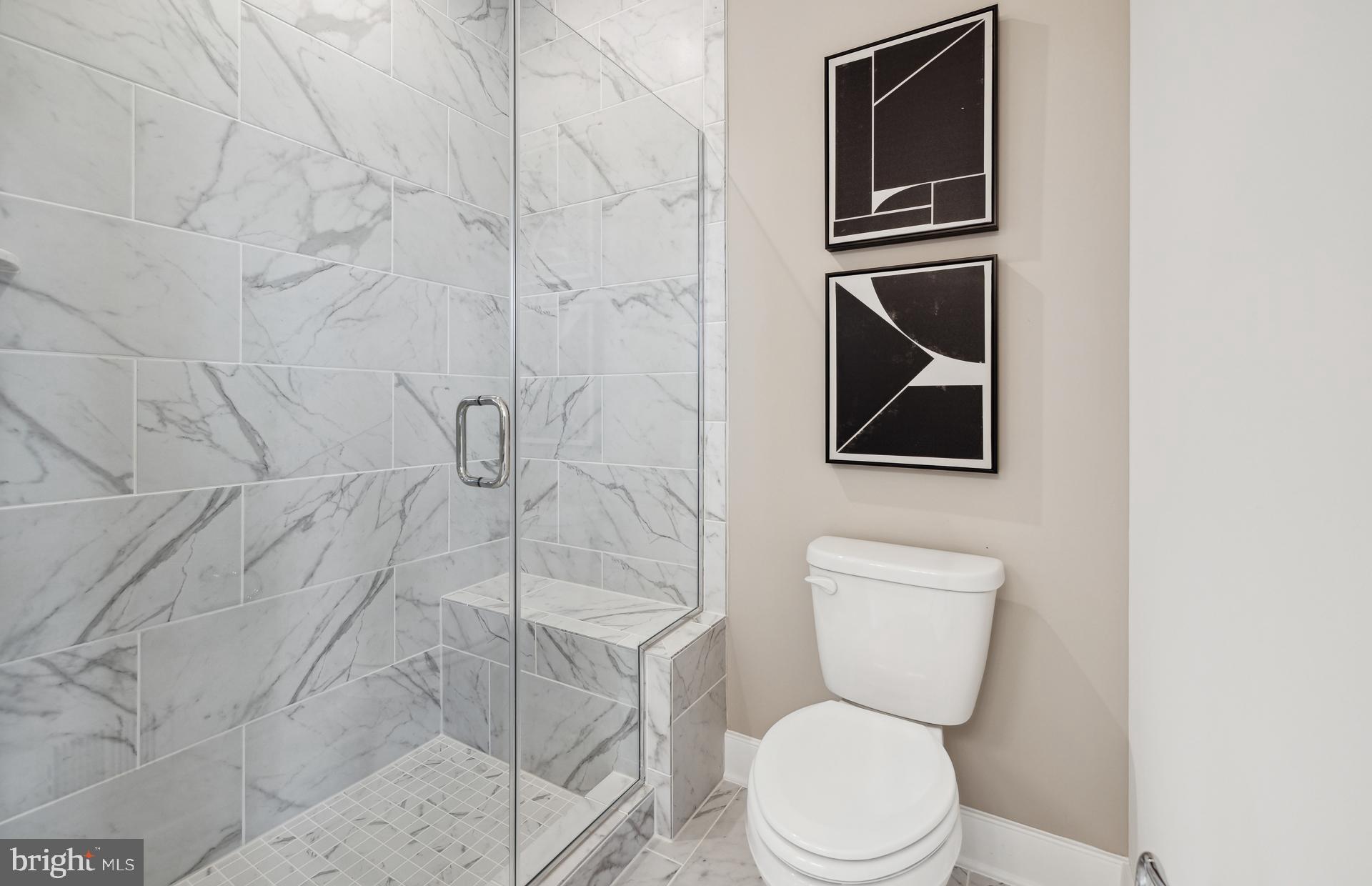 22424 Sculpin Brk Road Boyds, MD 20841 - Photo 10 of 37 a white toilet sitting next to a bathroom